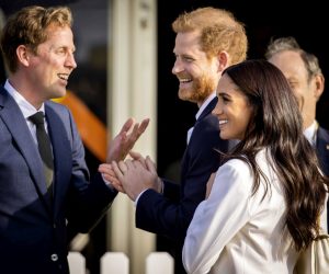 epa09891711 Britain's Prince Harry, Duke of Sussex (C) and his wife, Meghan, Duchess of Sussex (R) arrive on the Yellow Carpet before the start of the Invictus Games in The Hague, The Netherlands, 15 April 2022. The Invictus Games will take place from 16 to 22 April 2022 at the Zuiderpark and are intended for military personnel and veterans who have been psychologically or physically injured in service.  EPA/REMKO DE WAAL