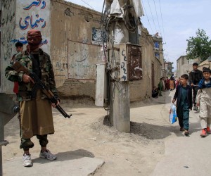 epa09896905 Taliban stand guard in an area surrounding a school in the aftermath of multiple bomb blasts in a Shi'ite majority neighborhood, in Kabul, Afghanistan, 19 April 2022. At least four people were killed and several others were injured in consecutive suspected suicide blasts.  EPA/STRINGER
