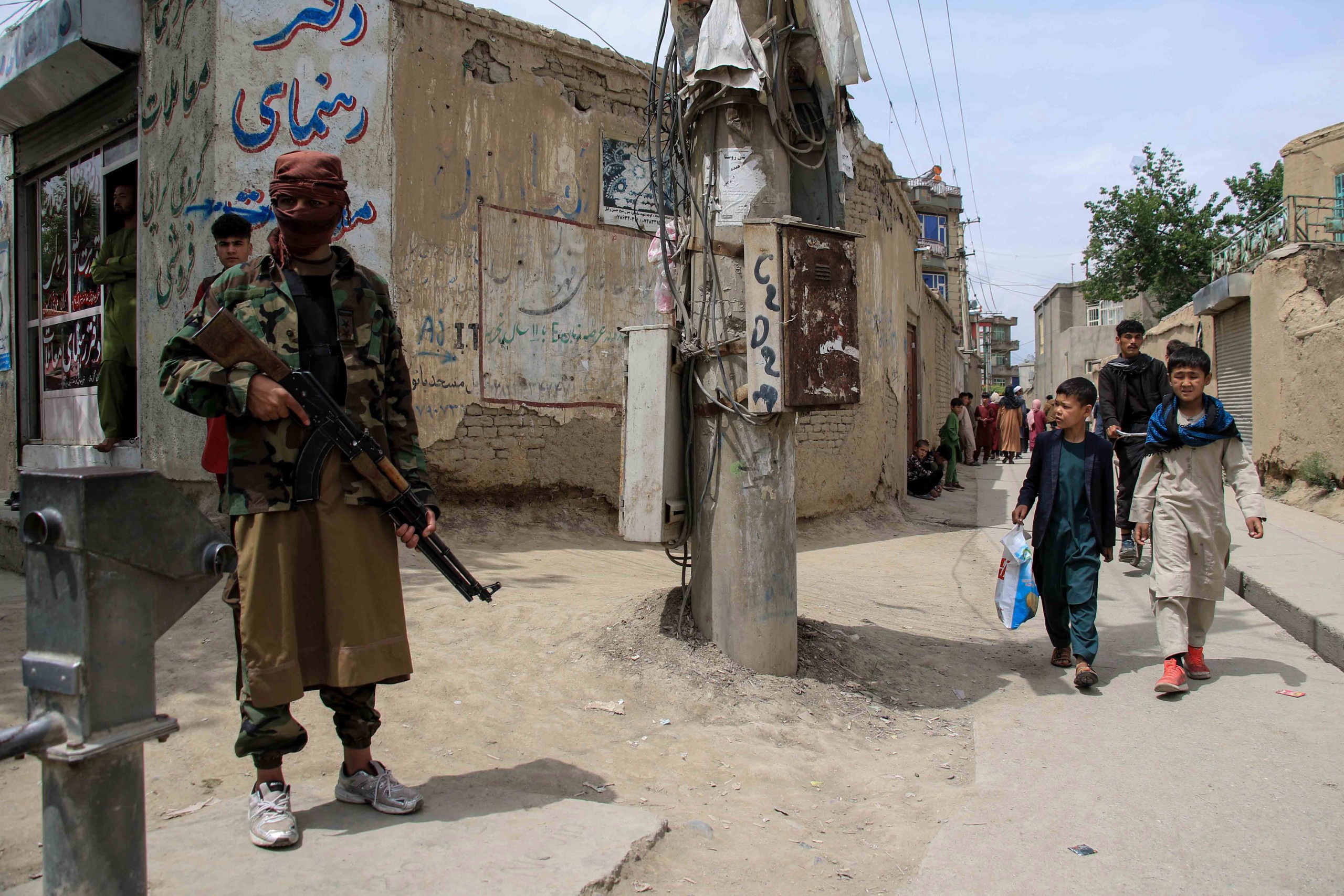 epa09896905 Taliban stand guard in an area surrounding a school in the aftermath of multiple bomb blasts in a Shi'ite majority neighborhood, in Kabul, Afghanistan, 19 April 2022. At least four people were killed and several others were injured in consecutive suspected suicide blasts.  EPA/STRINGER