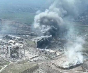 epa09896967 A frame grab from an undated handout drone video first published by DPR militia commander Alexander Khodakovsky and made available by the Mariupol City Council shows smoke rising from the Azovstal steel plant during airstrikes in Mariupol, eastern Ukraine, 18 April (issued 19 April 2022). The Russian Defence Ministry on 19 April 2022 issued a statement calling on the Ukrainian forces in Mariupol "to cease any hostilities and lay down their arms. All who lay down their weapons are guaranteed the preservation of life." The city council on 18 April 2022 via their official Telegram channel said that at least 1,000 civilians are sheltering in the underground shelters of the metallurgical plant, and that heavy bombs were dropped on the Azovstal plant by Russian forces.  EPA/MARIUPOL CITY COUNCIL HANDOUT  HANDOUT EDITORIAL USE ONLY/NO SALES