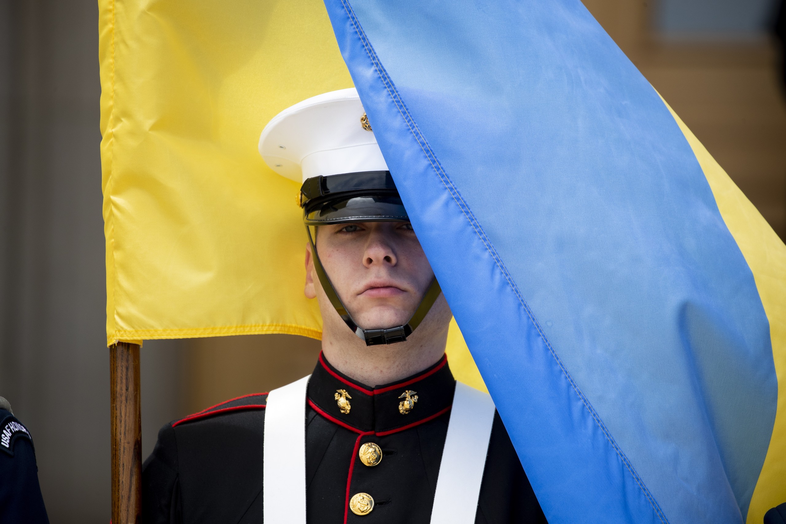 epa09901178 A member of a United States military color guard holds the national flag of Ukraine for an honor cordon ceremony welcoming Prime Minister of Ukraine Denys Shmyhal (not pictured) at the Pentagon in Arlington, Virginia, USA, 21 April 2022. Shmyhal is in Washington for a series of high-level meetings seeking continued US military and financial commitments to Ukraine as the Russian invasion continues in the eastern European country.  EPA/MICHAEL REYNOLDS