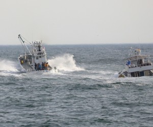 epa09906132 Fishing boats are leaving Utoro port to help in rescue operations in Shari, northern island of Hokkaido, Japan, 24 April 2022. A tour boat  with 26 people went missing off the western coast of Shiretoko Peninsula in Hokkaido on 23 April 2022. Japan Coast Guard has announced 10 people were found dead and no crew member was found yet.  EPA/JIJI PRESS JAPAN OUT EDITORIAL USE ONLY/  NO ARCHIVES