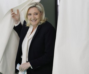 epaselect epa09906123 French far-right Rassemblement National (RN) party candidate for the French presidential election Marine Le Pen  leaves the voting booth at a polling station for the second round of the French presidential elections in Henin-Beaumont, France, 24 April 2022.  EPA/Ian Langsdon