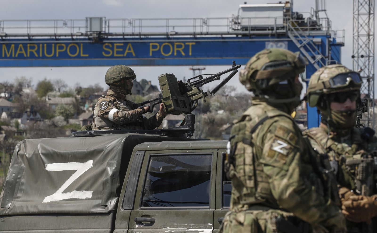 epa09917501 A picture taken during a visit to Mariupol organized by the Russian military shows Russian servicemen guard the territory of the cargo sea port in Mariupol, Ukraine, 29 April 2022. Mariupol is located on the northern coast of the Sea of Azov, it is one of the largest commercial seaports in Ukraine. Almost 500 thousand people previously lived in the city. On 16 April, the Russian Defense Ministry announced that the urban area of Mariupol had been cleared of the Ukrainian military, and their remnants were completely blocked on the territory of the Azovstal metallurgical plant. On 24 February Russian troops had entered Ukrainian territory in what the Russian president declared a 'special military operation', resulting in fighting and destruction in the country, a huge flow of refugees, and multiple sanctions against Russia.  EPA/SERGEI ILNITSKY