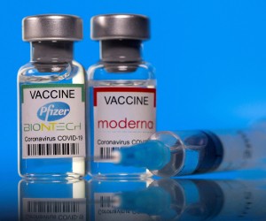 FILE PHOTO: Vials with Pfizer-BioNTech and Moderna coronavirus disease (COVID-19) vaccine labels are seen in this illustration picture taken March 19, 2021. REUTERS/Dado Ruvic/Illustration/File Photo Photo: DADO RUVIC/REUTERS
