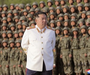 epa09915666 A photo released by the official North Korean Central News Agency (KCNA) shows North Korean Supreme Leader Kim Jong-Un wearing a white marshal uniform, during a photo session with the officers and soldiers that took part in a military parade, in Pyongyang, North Korea, 27 April 2022 (issued 29 April 2022). The soldiers participated in a military parade in Pyongyang on April 25 to mark the 90th anniversary of the Korean People's Revolutionary Army.  EPA/KCNA   EDITORIAL USE ONLY