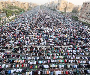 epa09922017 People attend Eid al-Fitr prayers outside Al-Seddik Mosque in Cairo, Egypt, 02 May 2022. Muslims around the world celebrate Eid al-Fitr, the three days festival marking the end of Ramadan. Eid al-Fitr is one of the two major holidays in the Islamic calendar.  EPA/KHALED ELFIQI