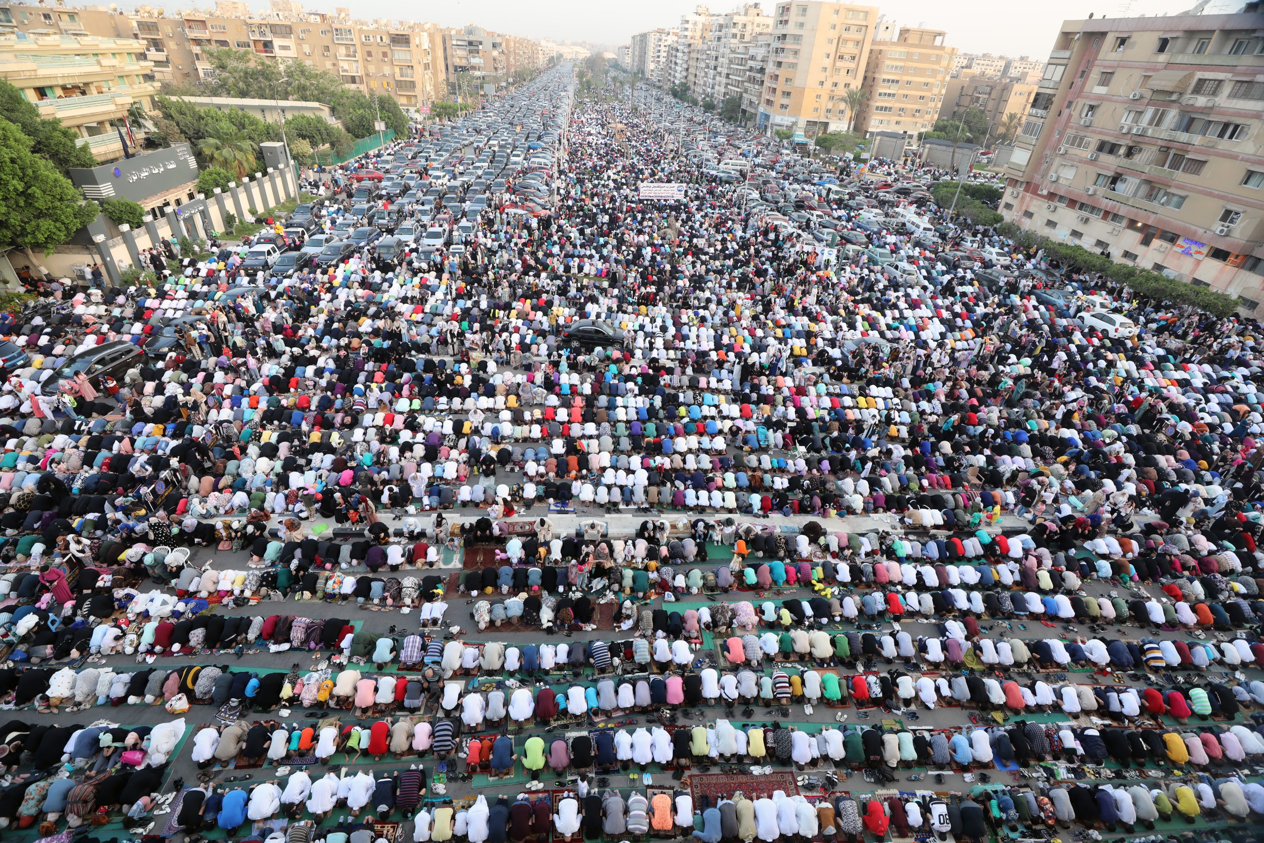 epa09922017 People attend Eid al-Fitr prayers outside Al-Seddik Mosque in Cairo, Egypt, 02 May 2022. Muslims around the world celebrate Eid al-Fitr, the three days festival marking the end of Ramadan. Eid al-Fitr is one of the two major holidays in the Islamic calendar.  EPA/KHALED ELFIQI