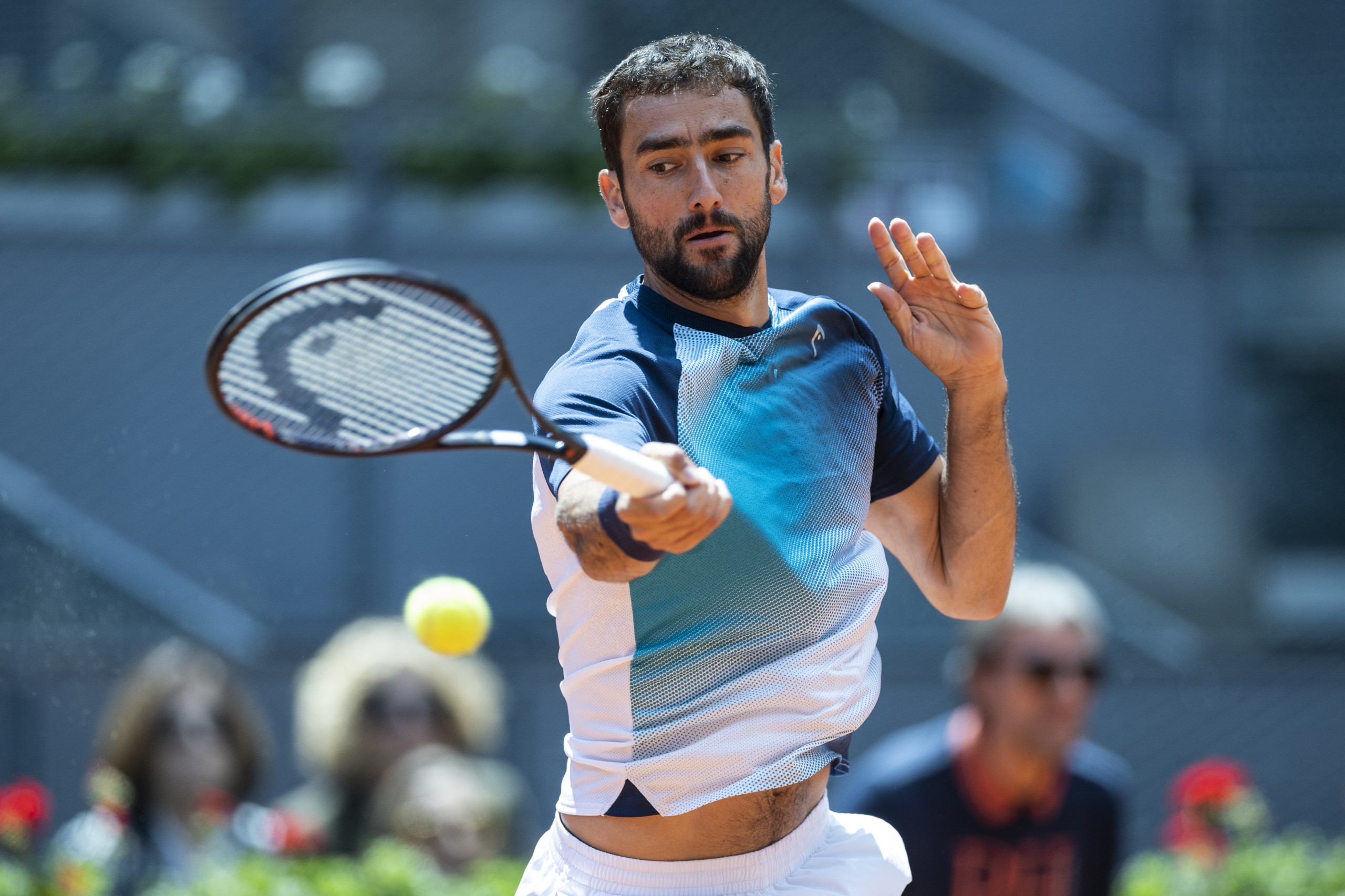 epaselect epa09926257 Marin Cilic of Croatia in action during his men's singles round of 32 match against Alexander Zverev of Germany at the Mutua Madrid Open tennis tournament at the Caja Magica in Madrid, Spain, 04 May 2022.  EPA/Rodrigo Jimenez