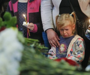 epa09926395 Ruslan's daughter Anna mourns near the coffin of her father, Ukrainian serviceman Ruslan Borovyk, during the funeral ceremony in St. Michaels Golden-Domed Monastery in Kyiv (Kiev), Ukraine, 04 May 2022. Ukrainian serviceman Ruslan Borovyk was killed in a battle in eastern Ukraine. Russian troops entered Ukraine on 24 February resulting in fighting and destruction in the country and triggering a series of severe economic sanctions on Russia by Western countries.  EPA/SERGEY DOLZHENKO