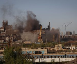 epa09932618 Smoke rises over Azovstal steel plant in Mariupol, Ukraine, 07 May 2022. According to the Interdepartmental Coordinating Headquarters of the Russian Federation for Humanitarian Response, 51 civilians, including 11 children, were evacuated from the Azovstal plant between 05 and 07 May. On 24 February, Russian troops had entered Ukrainian territory in what the Russian president declared a 'special military operation', resulting in fighting and destruction in the country. According to data released by the United Nations High Commission for the Refugees (UNHCR) on 05 May, over 5.7 million refugees have fled Ukraine seeking safety, protection and assistance in neighboring countries.  EPA/ALESSANDRO GUERRA