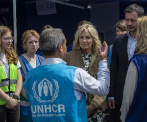 epa09933530 US First Lady Jill Biden (C) and Slovak Prime Minister Eduard Heger (R) meet with NGO workers at the Slovak-Ukraine border crossing in Vysne Nemecke, Slovakia, 08 May 2022. Jill Biden is currently on a tour of the region to meet with displaced Ukrainians, NGO workers and volunteers.  EPA/MARTIN DIVISEK
