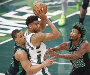 epa09936954 Milwaukee Bucks forward Giannis Antetokounmpo (C) looks to pass the ball against Boston Celtics forward Grant Williams (L) and guard Marcus Smart (R) during the first half of the NBA Eastern Conference semifinal playoff game four between the Milwaukee Bucs and Boston Celtics at Fiserv Forum, in Milwaukee, Wisconsin, USA, 09 May 2022.  EPA/KAMIL KRZACZYNSKI  SHUTTERSTOCK OUT