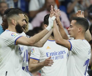 epa09943214 Real Madrid's Karim Benzema (L) celebrates with teammate Lucas Vazquez (R) after scoring the 2-0 lead during the Spanish LaLiga soccer match between Real Madrid and Levante UD in Madrid, Spain, 12 May 2022. Benzema equalized Raul Gonzalez's record as top goal scorer in Real Madrid's history.  EPA/JUANJO MARTIN