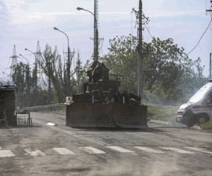 epa09965031 A Russian military vehicle moves towards the area surrounding the Azovstal steel plant to carry out a demining operation in Mariupol, Ukraine, 21 May 2022 (issued 22 May 2022). The Chief spokesman of the Russian Defense Ministry, Major General Igor Konashenkov, said on 20 May that the long-besieged Azovstal steel plant in Mariupol was under full Russian army control.  EPA/ALESSANDRO GUERRA