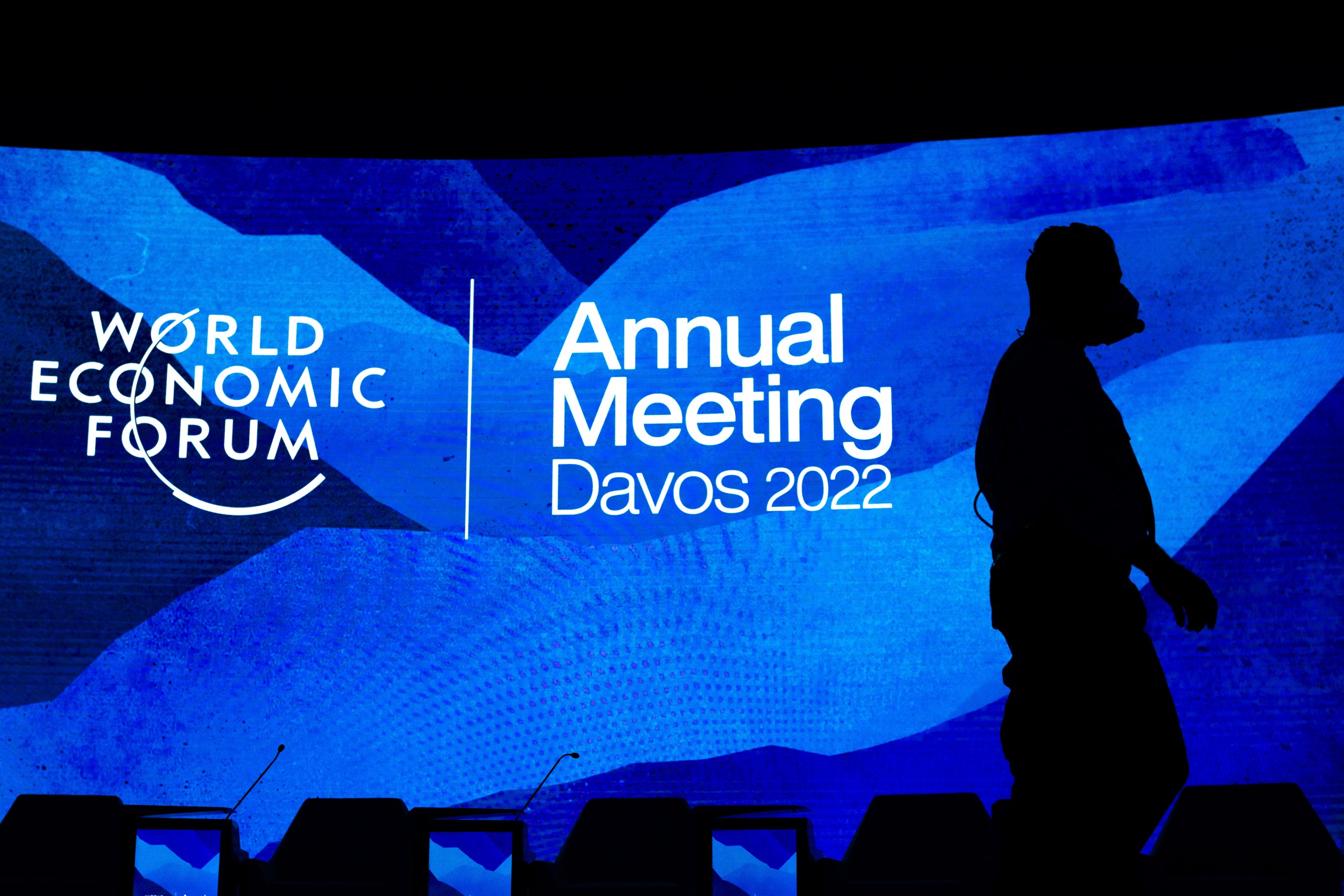 epa09965135 Workers set the stage prior the annual meeting of the World Economic Forum (WEF) in Davos, Switzerland, 22 May 2022. The forum begins 22 May, after being postponed due to the COVID-19 outbreak and rescheduled to early summer.  EPA/GIAN EHRENZELLER