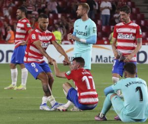 epa09967574 Granada players react after being relegated to Spanish Segunda Division following the Spanish LaLiga soccer match between Granada CF and RCD Espanyol in Barcelona, Spain, 22 May 2022.  EPA/Pepe Torres