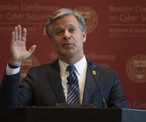 epa09989850 FBI Director Christopher A. Wray gesture during his keynote address at the sixth annual Boston Conference on Cyber Security at Boston College, in Boston, Massachusetts, USA, 01 June 2022.  EPA/CJ GUNTHER