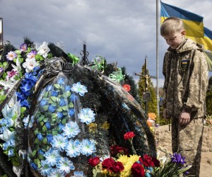 epa09991177 (FILE) - Ten-year-old Savelii reacts at his father's grave, who died defending Irpin as a member of territorial defense forces, in Irpin, Ukraine, 01 May 2022 (reissued 03 June 2022). 04 June 2022 marks 100 days since on 24 February 2022 Russian troops invaded Ukrainian territory in what the Russian president declared a "Special Military Operation", starting an armed conflict that has provoked destruction and a humanitarian crisis. According to the UNHCR, more than 6.8 million refugees have fled Ukraine, and a further 7.7 million people have been displaced internally within Ukraine since. The Russian invasion was met by Western countries with heavy economic sanctions against Russian companies and individuals, as well as weaponry deliveries and financial support to Ukraine.  EPA/MIKHAIL PALINCHAK  ATTENTION: This Image is part of a PHOTO SET *** Local Caption *** 57649678