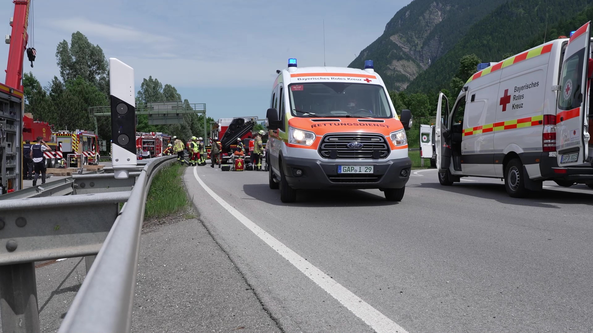 epa09993811 Emergency responders and firefighters work at the scene of a train derailment in Burgrain, near the resort town of Garmisch-Partenkirchen, southern Germany, 03 June 2022. According to the police and local officials, at least 3 people are reported dead and dozens were injured  in the train derailment. The regional train was heading north from the German Alps towards Munich.  EPA/NETWORK PICTURES