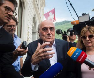 epa10001892 The former president of the World Football Association (Fifa), Joseph Blatter (C), speaks to the media as he leaves the Swiss Federal Criminal Court after the first day of his trial, in Bellinzona, Switzerland, 08 June 2022. Blatter and the former president of the the European Football Association (Uefa), Michel Platini, stand trial before the Federal Criminal Court from 08 June, over a suspicious two-million payment. The Federal Prosecutor's Office accuses them of fraud. The defense speaks of a conspiracy.  EPA/ALESSANDRO CRINARI