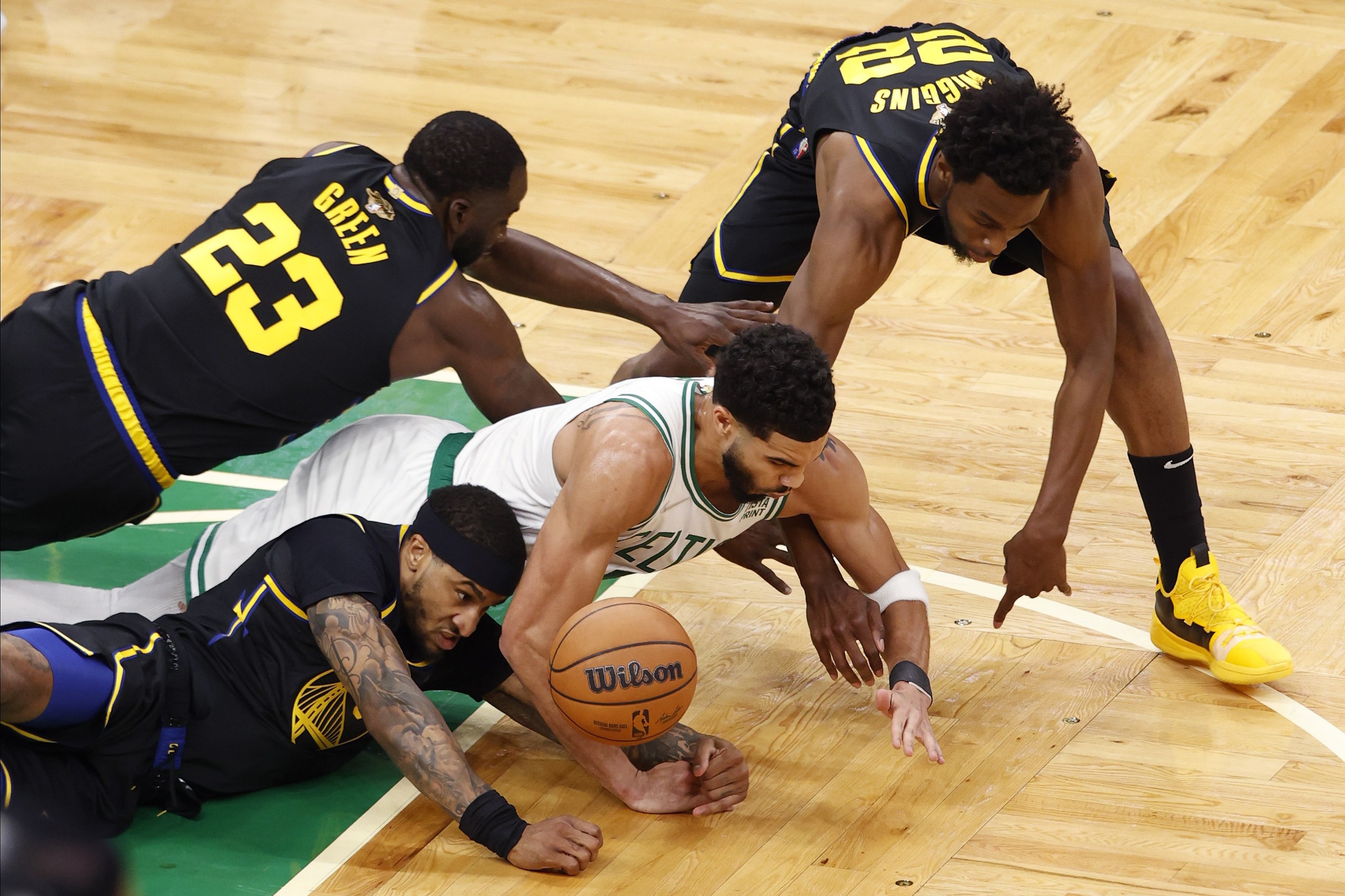 epa10003153 Boston Celtics forward Jayson Tatum (C), Golden State Warriors guard Gary Payton II (Bottom-L), Golden State Warriors forward Andrew Wiggins (R), and Golden State Warriors forward Draymond Green (Top-L), reach for a loose ball, during the first half of Game 3 of the National Basketball Association (NBA) Finals between the Boston Celtics and the Golden State Warriors at TD Garden, in Boston, Massachusetts, USA, 08 June 2022. The best of seven series is tied 1-1.  EPA/CJ GUNTHER  SHUTTERSTOCK OUT