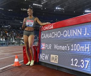 epa10004849 Jasmine Camacho-Quinn of Puerto Rico poses after setting a new meeting record time of 12.37 seconds in the women's 100m Hurdles race of the Diamond League Golden Gala athletics meeting at the Olimpico stadium in Rome, Italy, 09 June 2022.  EPA/Riccardo Antimiani