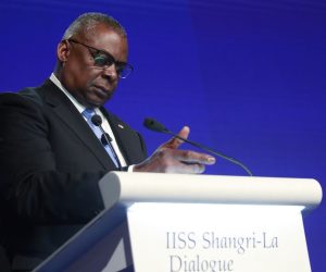epa10007014 United States Secretary of Defense Lloyd Austin adjusts the microphone before his speech, during the International Institute for Strategic Studies (IISS) Shangri-la Dialogue at the Shangri-la hotel, in Singapore, 11 June 2022. Defense ministers and officials from 42 countries are gathered in the city state for the IISS Shangri-la Dialogue, an annual high level defence summit in the Asia Pacific region that has been on hold for the past two years due to the Covid-19 pandemic. The summit will be held from 10-12 June 2022  EPA/HOW HWEE YOUNG