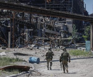 epa10011175 A picture taken during a visit to Mariupol organized by the Russian military shows Russian servicemen inspecting an area of the Azovstal steel plant in Mariupol, eastern Ukraine, 13 June 2022. According to a statement by the Ukrainian Presidential Office on 06 June quoting President Zelensky, there may be more than 2,500 prisoners from the Azovstal plant being held captive by Russian troops. On 24 February Russian troops had entered Ukrainian territory in what the Russian president declared a 'special military operation', resulting in fighting, and multiple sanctions against Russia.  EPA/SERGEI ILNITSKY