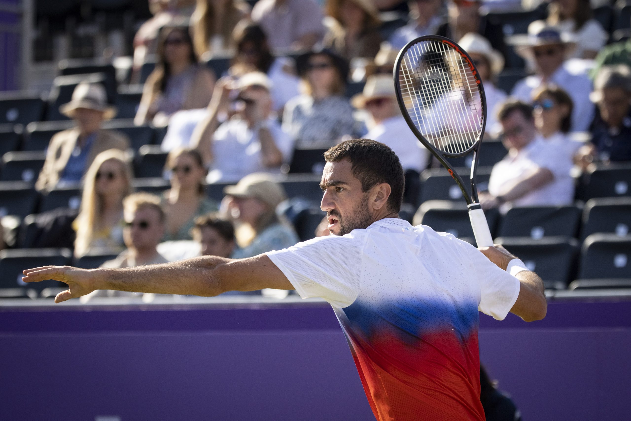 epa10011170 Marin Cilic of Croatia in action against Liam Broady of Britain during their first round match at the Queen's Club Championships tennis tournament in London, Britain, 13 June 2022.  EPA/TOLGA AKMEN
