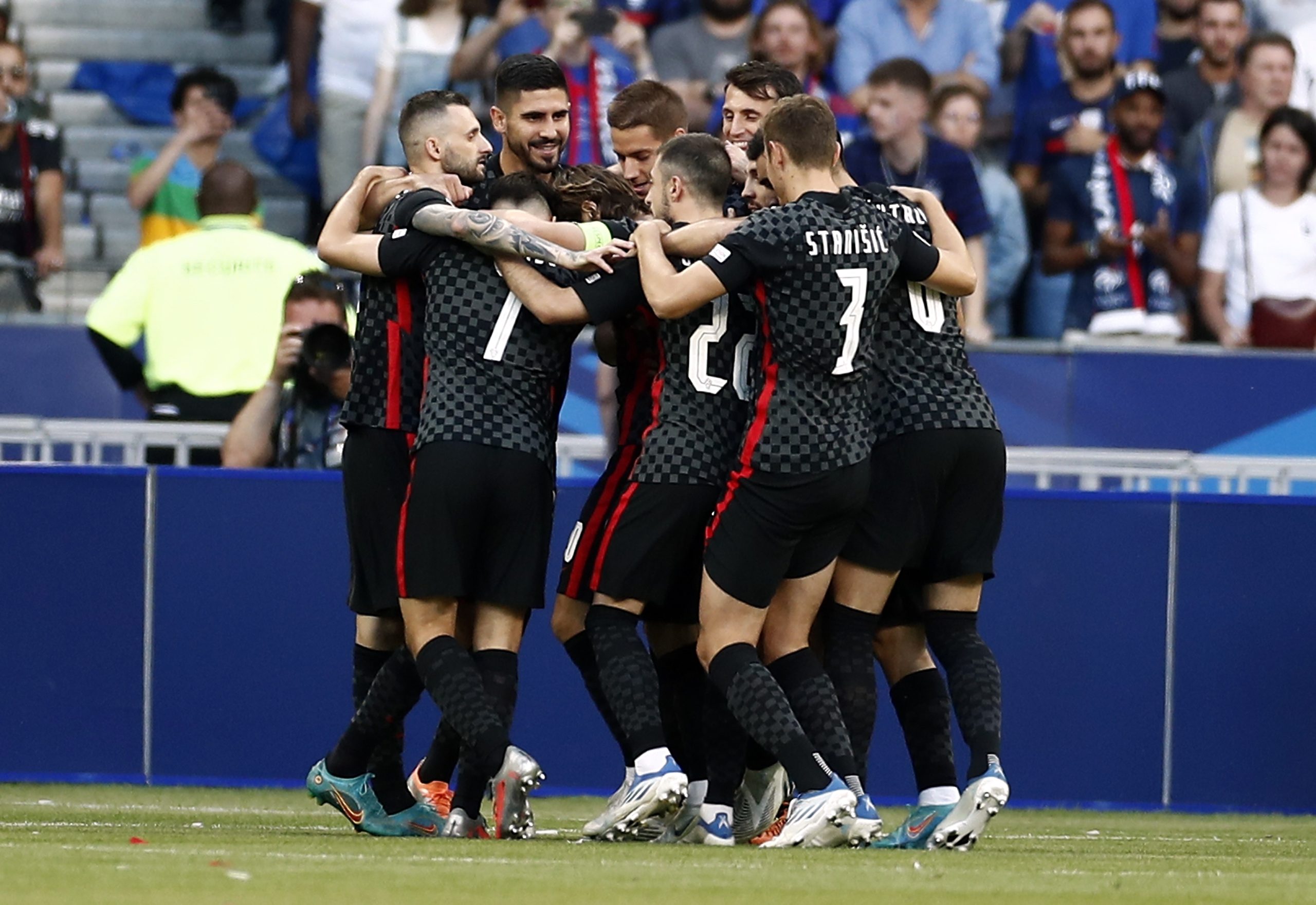 epa10011387 Players of Croatia celebrate after Luka Modric of Croatia scored the 1-0 by penalty during the UEFA Nations League soccer match between France and Croatia in Saint-Denis, near Paris, France, 13 June 2022.  EPA/Mohammed Badra
