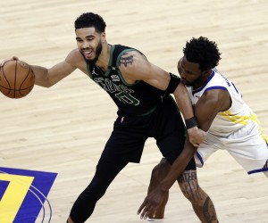 epa10011825 Boston Celtics forward Jayson Tatum (L) looks to control a loose ball while being defended by Golden State Warriors forward Andrew Wiggins (R) during the first half of the National Basketball Association (NBA) Finals playoff game five between the Golden State Warriors and the Boston Celtics at the Chase Center in San Francisco, California, USA, 13 June 2022.  EPA/JOHN G. MABANGLO SHUTTERSTOCK OUT