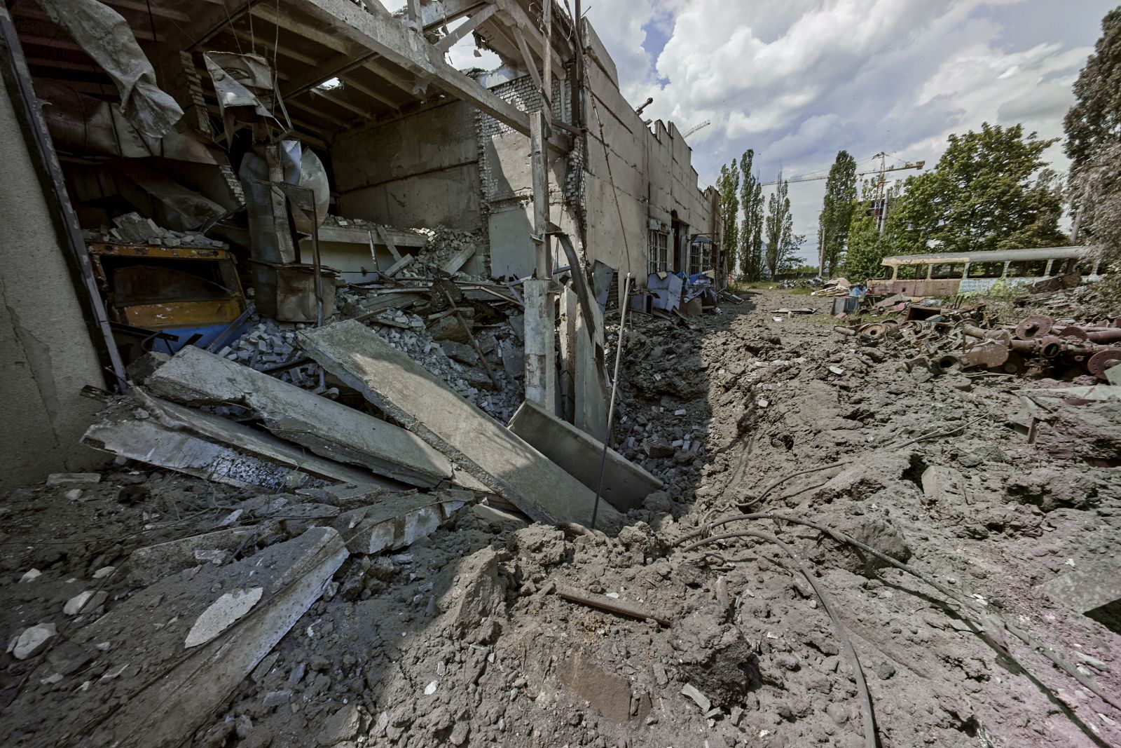 epa10020771 A destroyed tramway depot after recently shelling in Kharkiv, Ukraine, 18 June 2022. Kharkiv, Ukraine's second-largest city, and its surroundings were a center of heavy fightings before the Ukrainian army recaptured the area. On 24 February Russian troops had invaded Ukraine starting a conflict that brought death and destruction and a humanitarian crisis to the country.  EPA/SERGEY KOZLOV
