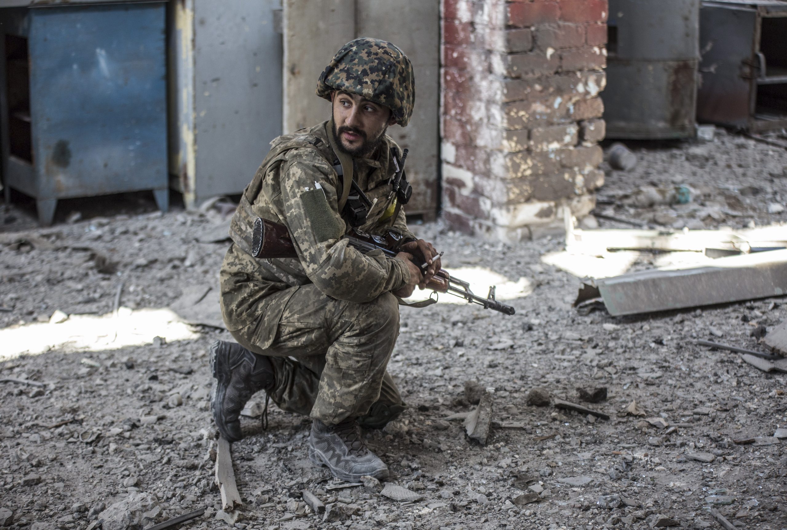 epa10026519 A Ukrainian serviceman smokes on a position in the city of Severodonetsk of Luhansk area, Ukraine 19 June 2022 (issued 21 June 2022). The city of Severodonetsk and its surroundings witnessed heavy fighting for the last days. Ukrainian troops control a part of city include the Azot plant where 568 people, including 38 children, remain in the bomb shelters, the head of the Luhansk Regional State Administration Serhiy Haidai said on June 21. On 24 February Russian troops entered Ukrainian territory starting a conflict that has provoked destruction and a humanitarian crisis.  EPA/OLEKSANDR RATUSHNIAK
