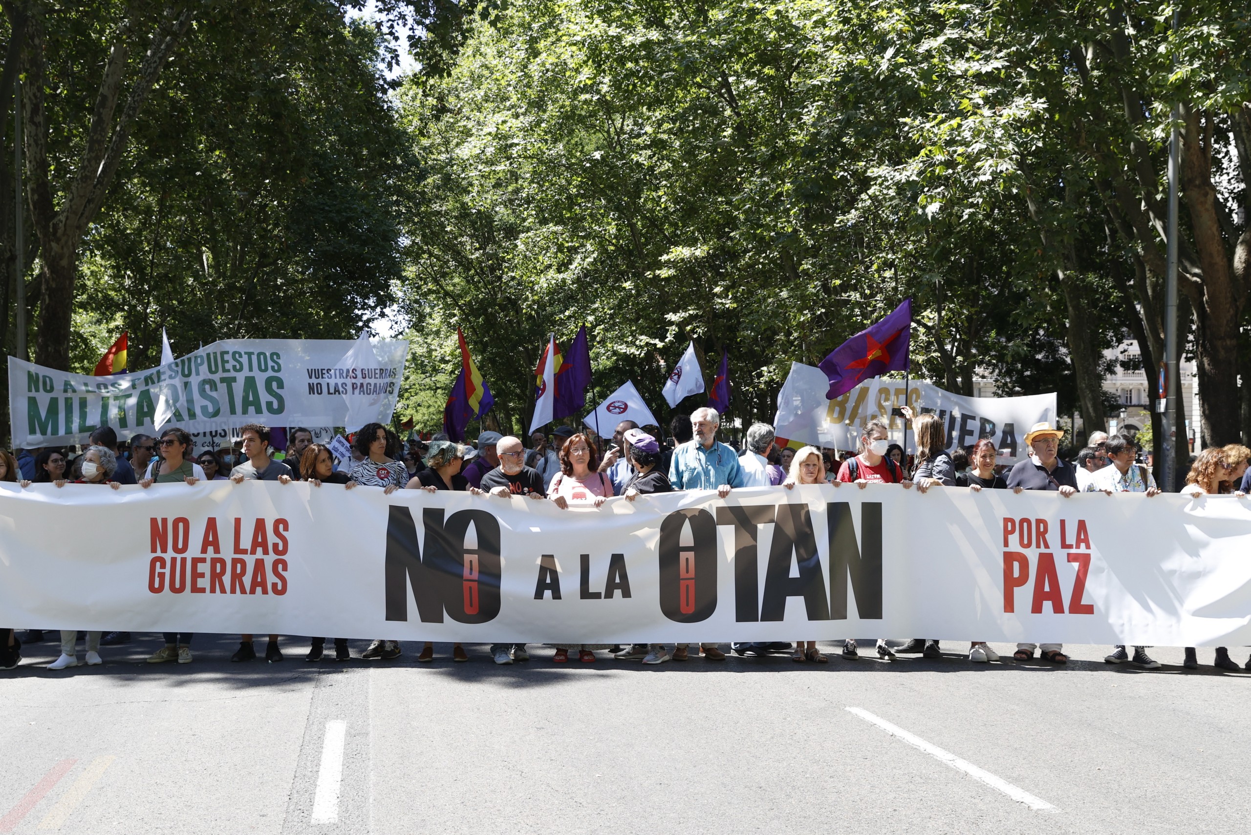 epa10034868 People attend a protest against NATO ahead of a NATO summit to be held in Madrid, Spain, 26 June 2022. A NATO Summit will be held in Madrid from 29 to 30 June.  EPA/J.J. Guillen