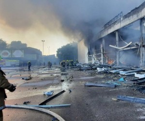 epa10036939 A handout photo released by the press service of the State Emergency Service (SES) of Ukraine shows firefighters and rescue services extinguishing a fire at a shopping center in Kremenchuk, Ukraine, 27 June 2022. The State Emergency Service (SES) of Ukraine said that, confimation pending, at least two 2 people died and 20 were injured in the fire following missile strikes. The one-story building of a shopping center was hit by rockets, the SES stated further.  EPA/STATE EMERGENCY SERVICE OF UKRAINE HANDOUT -- BEST QUALITY AVAILABLE -- MANDATORY CREDIT: STATE EMERGENCY SERVICE OF UKRAINE -- HANDOUT EDITORIAL USE ONLY/NO SALES