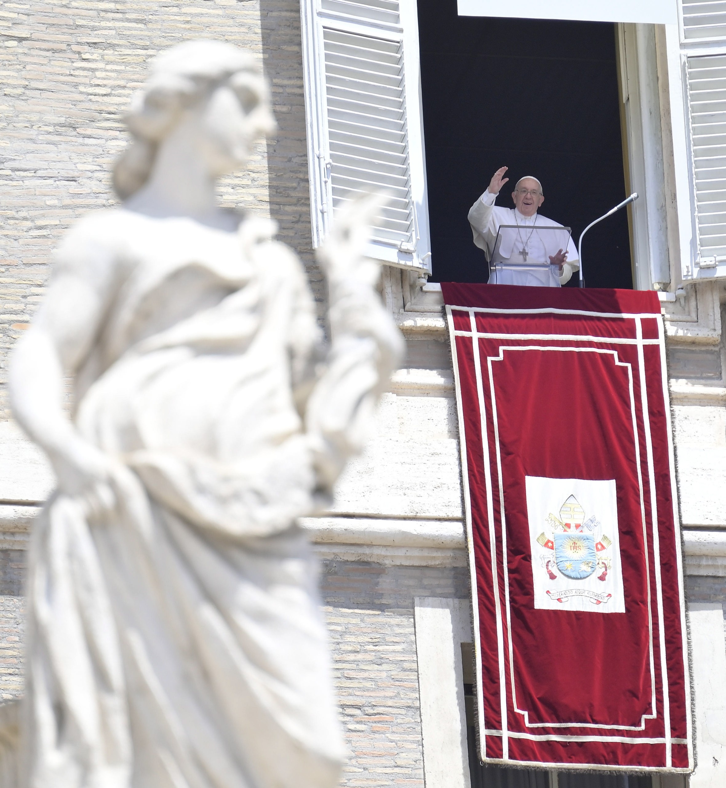 epa10034867 Pope Francis waves from the window of his office overlooking Saint Peter's Square as he leads the Sunday Angelus prayer, in Vatican City, 26 June 2022.  EPA/CLAUDIO PERI