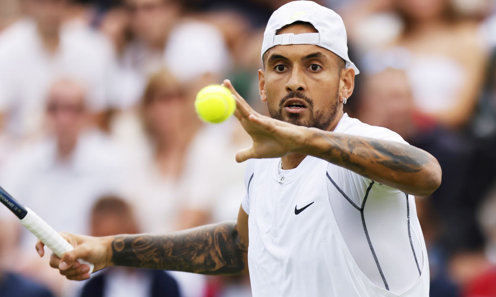 epa10038301 Nick Kyrgios of Australia eyes the ball in the men's first round match against Paul Jubb of Great Britain at the Wimbledon Championships, in Wimbledon, Britain, 28 June 2022.  EPA/TOLGA AKMEN   EDITORIAL USE ONLY