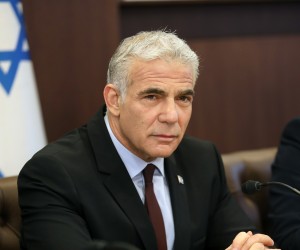 epa10049011 Israel's caretaken Prime Minister Yair Lapid chairs the first cabinet meeting in Jerusalem, 03 July 2022, days after lawmakers dissolved parliament.  EPA/GIL COHEN-MAGEN / POOL