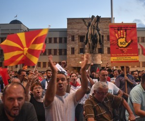 epa10058121 Supporters of the opposition party VMRO DPMNE and other citizens shout anti- government slogans, during a protest against the French proposal to resolve the dispute between North Macedonia and Bulgaria in front of the Parliament building in Skopje, Republic of North Macedonia, 07 July 2022. The biggest opposition party VMRO DPMNE, leads the protest against the French proposal, which comes after North Macedonia's Government intervention in Brussels and reaction to the draft documents that the public had the opportunity to discuss last week. The official views for the French proposal will be announced after the proposal passes the filters of all relevant institutions.  EPA/GEORGI LICOVSKI