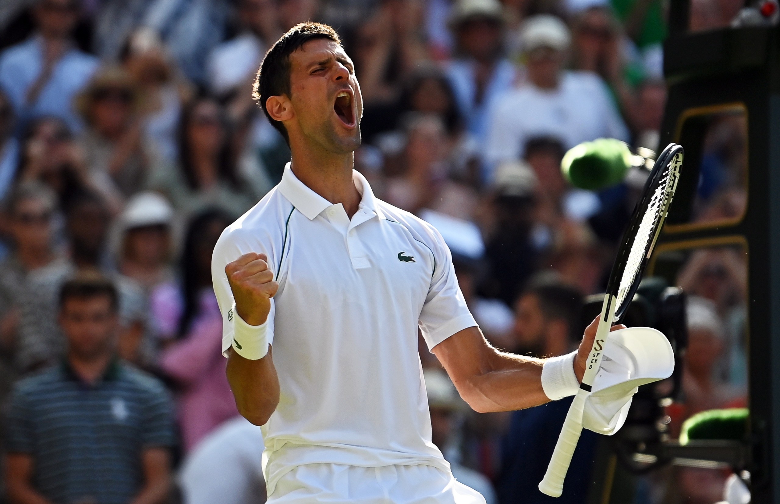 epa10059863 Novak Djokovic of Serbia celebrates after winning his men's semi final match against Cameron Norrie of Britain at the Wimbledon Championships in Wimbledon, Britain, 08 July 2022.  EPA/NEIL HALL   EDITORIAL USE ONLY