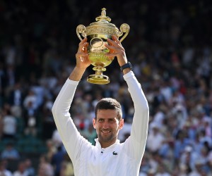 epa10064051 Novak Djokovic of Serbia poses with the trophy after winning the men's final match against Nick Kyrgios of Australia at the Wimbledon Championships, in Wimbledon, Britain, 10 July 2022.  EPA/NEIL HALL   EDITORIAL USE ONLY