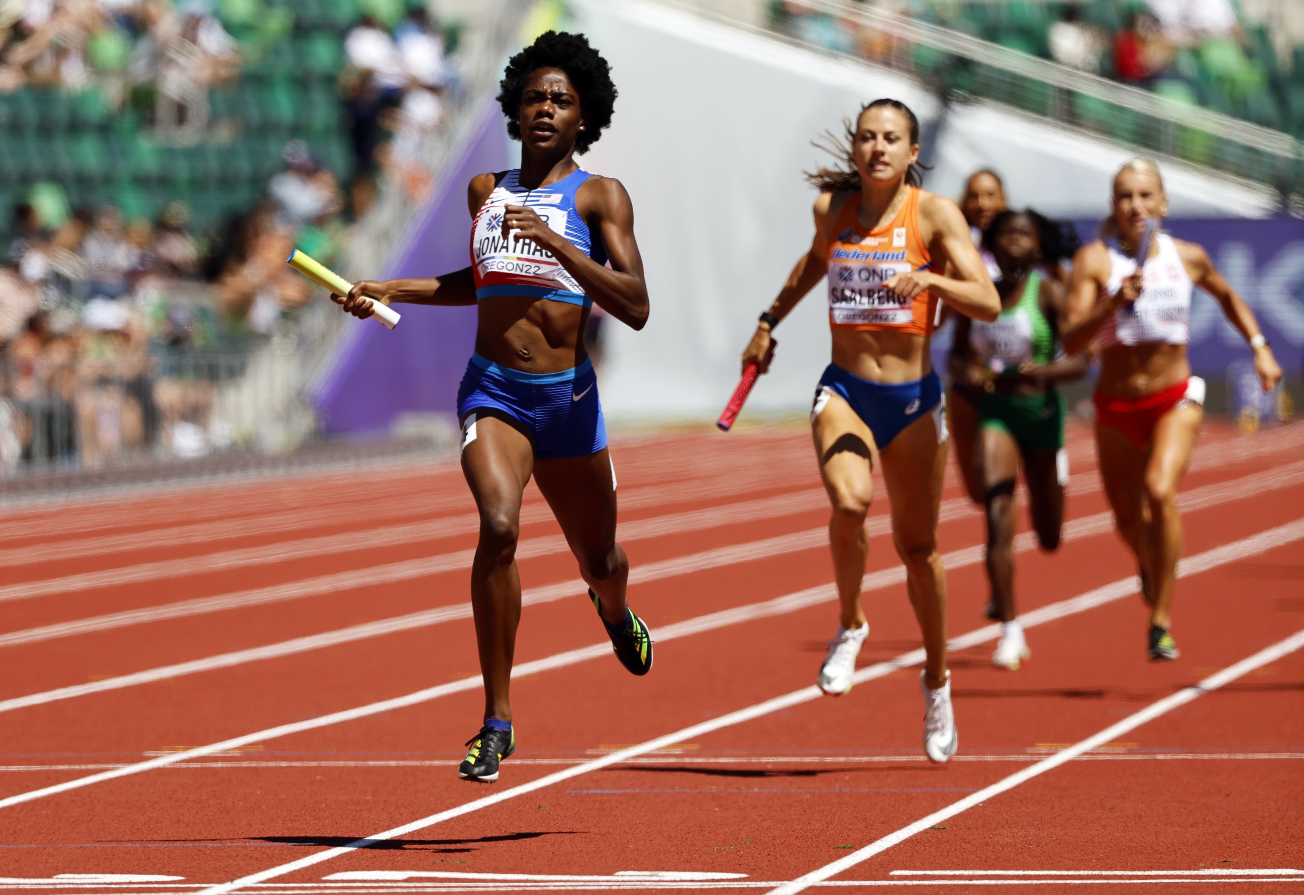 epa10073450 Wadeline Jonathas (L) of the USA crosses the finish line during the 4x400m Mixed Relay heats at the World Athletics Championships Oregon22 at Hayward Field in Eugene, Oregon, USA, 15 July 2022.  EPA/John G. Mabanglo