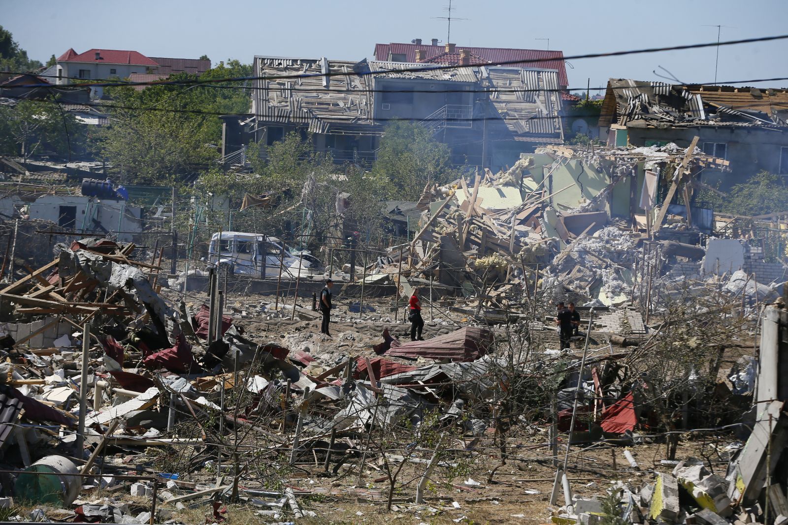 epa10092249 Rescuers and policemen inspect a site of a missile strike in Odesa area, Ukraine, 26 July 2022. A massive missile strike was inflicted on the south of Ukraine in the wee hours of 26 July by Russian forces from the waters of the Black Sea, the spokesperson of the Command of the Air Force of the Armed Forces of Ukraine said. Several private buildings and infrastructure objects were destroyed, no fatalities in that attack were reported. Russian troops on 24 February entered Ukrainian territory, starting a conflict that has provoked destruction and a humanitarian crisis.  EPA/STRINGER
