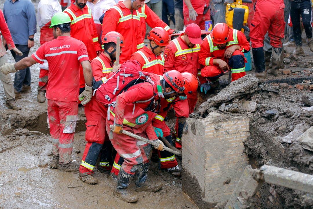 epa10097139 A handout photo made available by the Iranian Red Crescent Society (IRCS) shows rescue workers working at the site of a flash flood in Imam Zadeh Davood, north-west of Tehran, Iran, 29 July 2022. According to the Iranian Red Crescent Society quoting local officials, at least eight people have been killed in floods in Imam Zadeh Davood and some are still missing, as many cities are struggling with floods all over the Iran.  EPA/IRANIAN RED CRESCENT HANDOUT  HANDOUT EDITORIAL USE ONLY/NO SALES