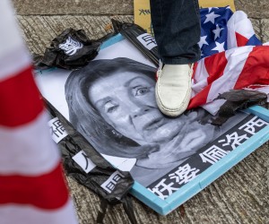 epaselect epa10103683 A group of pro-China supporters steps on a mock up funeral photo of US House Speaker Nancy Pelosi outside of the US Consulate General in Hong Kong and Macau, in Hong Kong, China, 03 August 2022. The group protested the visit to Taiwan by Nancy Pelosi who is leading a Congressional delegation to the Indo-Pacific region with stops in Singapore, Malaysia, South Korea and Japan.  EPA/JEROME FAVRE