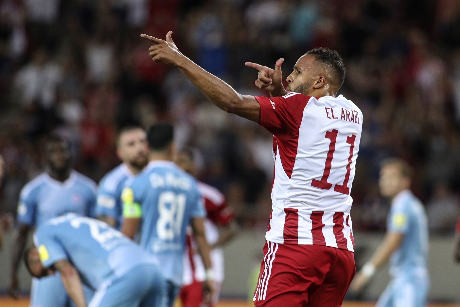 epa10106427 Olympiacos' Youssef El-Arabi reacts after scoring the equaliser 1-1 during the UEFA Europa League third qualifying round, 1st leg soccer match between Olympiacos Piraeus and Slovan Bratislava in Piraeus, Greece, 4 August 2022.  EPA/PANAGIOTIS MOSCHANDREOU