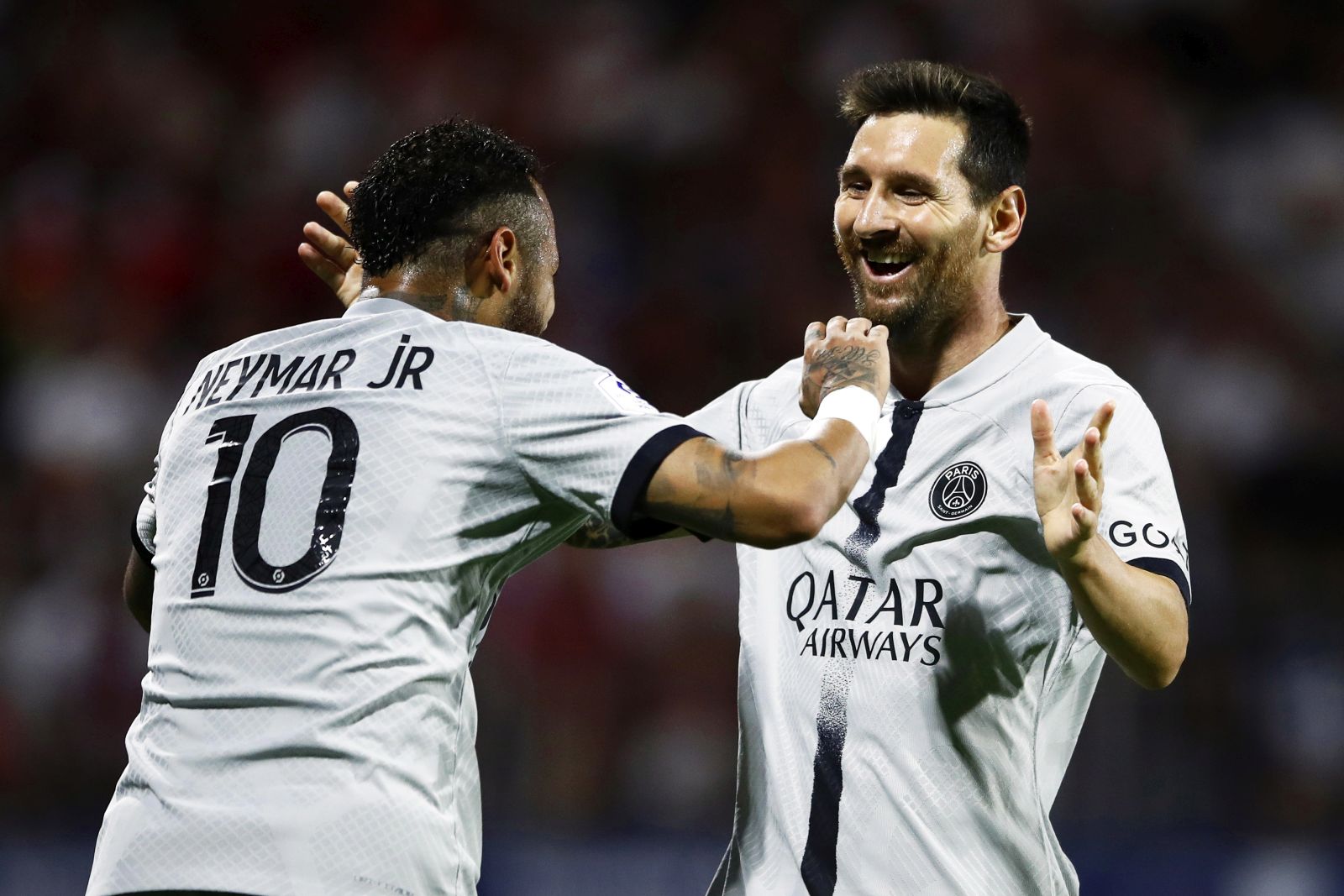 epa10109359 Paris Saint-Germain's Lionel Messi (R) celebrates with teammate Neymar (L) after scoring the 4-0 lead during the French Ligue 1 soccer match between Clermont Foot 63 and Paris Saint-Germain (PSG) in Clermont-Ferrand, France, 06 August 2022.  EPA/Mohammed Badra