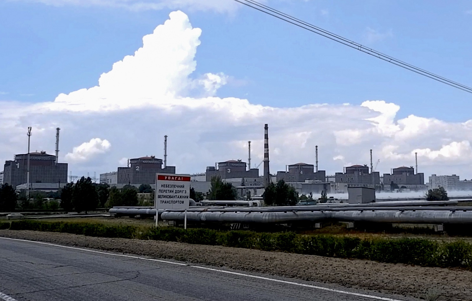 epa10110513 A still image taken a handout video provided  by the Russian Defence Ministry's press service shows a general view of the Zaporizhzhia Nuclear Power Station (ZNPP) in Enerhodar, southeastern Ukraine, 07 August 2022. The administration of Russian-controlled Enerhodar said that Ukrainian forces "launched a strike using a 220-mm Uragan MLRS rocket" towards the ZNPP and that it had "managed to open up and release fragmentation submunitions" while approaching, whereas Ukrainian state-owned plant operator Energatom stated that the Russian forces on 06 August "fired rockets at the site of the Zaporizhzhya nuclear power plant and the city of Energodar" hitting next to the ZNPP's facility where spent nuclear fuel is stored. Zaporizhzhia NPP with six power units is the largest nuclear power plant in Europe and was seized by Russian forces early in March 2022. Russian troops on 24 February entered Ukrainian territory, starting an armed conflict that has provoked destruction and a humanitarian crisis.  EPA/RUSSIAN EMERGENCIES MINISTRY HANDOUT  HANDOUT EDITORIAL USE ONLY/NO SALES