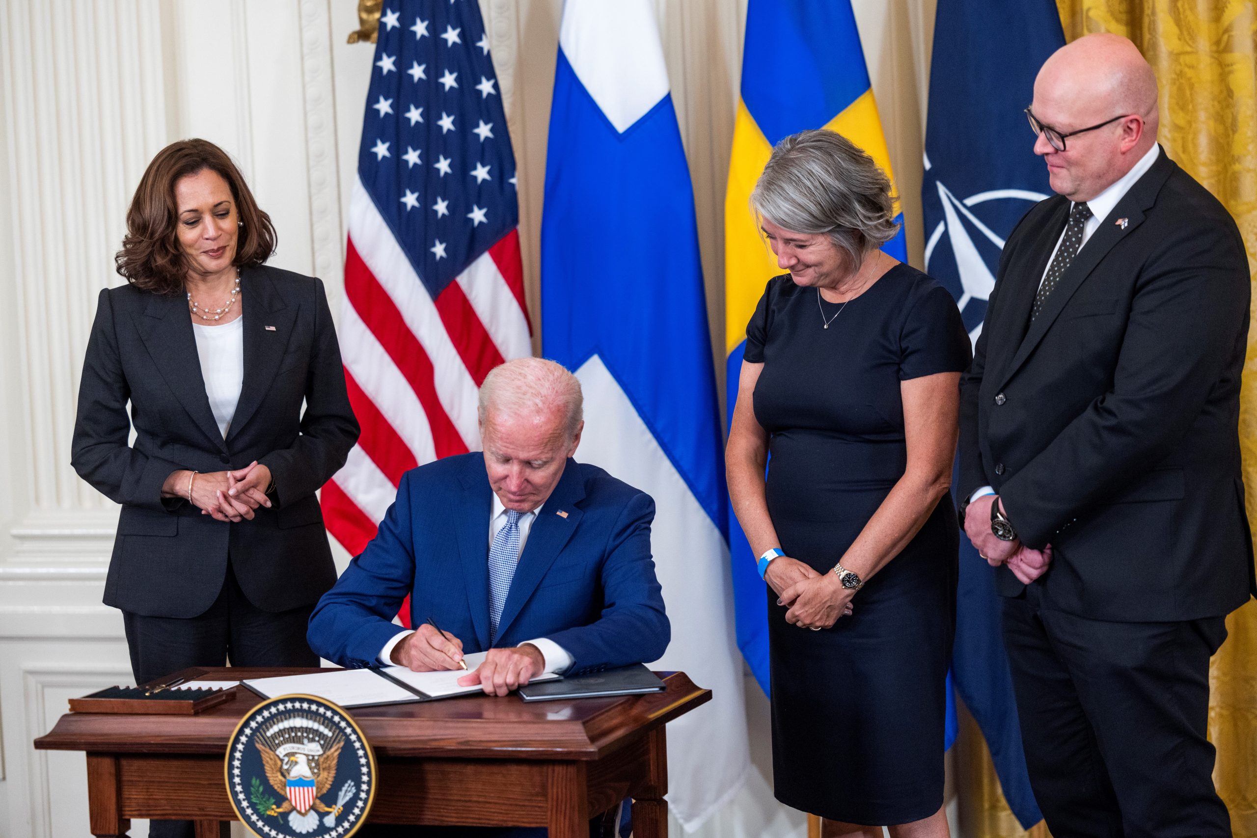 epa10113031 US President Joe Biden (C-L), alongside Vice President Kamala Harris (L), Swedish Ambassador to the US Karin Ulrika Olofsdotter (C-R), and Finnish Ambassador to the US Mikko Hautala (R), signs the Instruments of Ratification for the Accession Protocols to the North Atlantic Treaty (NATO) for Finland and Sweden in the East Room of the White House in Washington, DC, USA, 09 August 2022. The two Nordic countries are seeking to join NATO following Russia's invasion of Ukraine.  EPA/JIM LO SCALZO